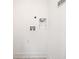 A pristine white wall showing clean laundry hookups and utility connections at 2668 Brown Nw St, Atlanta, GA 30318