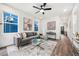 Inviting living room featuring a comfortable gray sofa, stylish decor, and ample natural light at 2668 Brown Nw St, Atlanta, GA 30318