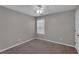 Simple bedroom featuring carpeted floor and a ceiling fan at 3248 Meadow Point Dr, Snellville, GA 30039