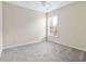 Neutral bedroom featuring gray carpet, a window, and a ceiling fan at 3280 Cooper Woods Dr, Loganville, GA 30052