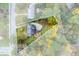 An aerial view showcases the property and its tree-surrounded lot, highlighting the driveway at 6596 Wright Rd, Atlanta, GA 30328