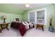Comfortable bedroom with hardwood floors, bright natural light, and classic decor at 6596 Wright Rd, Atlanta, GA 30328