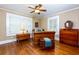 Charming bedroom with hardwood floors, chest, wood furniture, and shuttered windows at 6596 Wright Rd, Atlanta, GA 30328