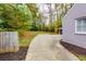 Grey house surrounded by trees, with a long driveway at 6596 Wright Rd, Atlanta, GA 30328