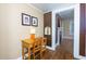 Hallway with hardwood floors leading to the study area and a glimpse of a charming fireplace at 6596 Wright Rd, Atlanta, GA 30328