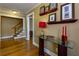 Charming hallway with hardwood floors, glass table, and staircase leading to the upper level of the home at 6596 Wright Rd, Atlanta, GA 30328