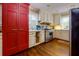 Bright kitchen featuring stainless steel appliances, white cabinets, and hardwood floors at 6596 Wright Rd, Atlanta, GA 30328