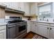 Cozy kitchen with stainless steel range, white countertops, and ample cabinet space at 6596 Wright Rd, Atlanta, GA 30328