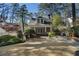 Lovely backyard with lush greenery, stone patio, well-maintained lawn and beautiful house view for serene outdoor living at 1605 E Sussex Ne Rd, Atlanta, GA 30306