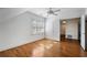 Sunlit bedroom featuring hardwood floors and shuttered windows, offers a serene and inviting space for relaxation at 1605 E Sussex Ne Rd, Atlanta, GA 30306