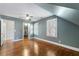 Bright bedroom with hardwood floors and plantation shutters offers a tranquil space with ample natural light and easy closet access at 1605 E Sussex Ne Rd, Atlanta, GA 30306