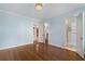 Bright bedroom featuring hardwood floors and an ensuite bathroom with walk in closet at 1605 E Sussex Ne Rd, Atlanta, GA 30306