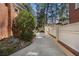 Long concrete driveway bordered by a fence, providing ample parking space at 1605 E Sussex Ne Rd, Atlanta, GA 30306