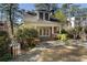 Charming brick home with a welcoming front porch and manicured landscaping at 1605 E Sussex Ne Rd, Atlanta, GA 30306