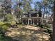 Charming brick home with dormer windows, mature trees, and manicured lawn at 1605 E Sussex Ne Rd, Atlanta, GA 30306