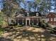 Charming brick home with dormer windows, black shutters, and a well-manicured lawn in a desirable neighborhood at 1605 E Sussex Ne Rd, Atlanta, GA 30306