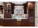 Kitchen featuring an undermount sink, custom cabinetry, granite countertops and stainless steel appliances at 1605 E Sussex Ne Rd, Atlanta, GA 30306