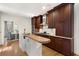 Gourmet kitchen featuring a butcher block island, custom cabinetry, granite countertops and stainless steel appliances at 1605 E Sussex Ne Rd, Atlanta, GA 30306