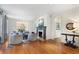 Bright living room with hardwood floors, fireplace, elegant furniture, and an archway that leads to other spaces at 1605 E Sussex Ne Rd, Atlanta, GA 30306