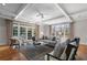 Bright living room featuring hardwood floors, coffered ceiling, and French doors to the exterior at 1605 E Sussex Ne Rd, Atlanta, GA 30306