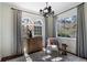 Sitting room featuring windows, neutral-toned walls, curtains, a decorative rug, and natural light at 1605 E Sussex Ne Rd, Atlanta, GA 30306