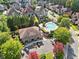 Community clubhouse and swimming pool amid lush greenery and well-maintained homes at 1965 Carlotta Ct, Atlanta, GA 30345