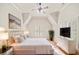 Inviting bedroom with vaulted ceiling, plantation shutters, neutral decor, and a ceiling fan at 1965 Carlotta Ct, Atlanta, GA 30345