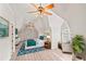 Upstairs bedroom with vaulted ceiling, hardwood floors, a sitting area, and a large window at 1965 Carlotta Ct, Atlanta, GA 30345