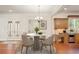 Cozy breakfast nook featuring a round table and chairs, with natural light and hardwood floors at 1965 Carlotta Ct, Atlanta, GA 30345