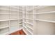 Walk-in closet featuring custom white shelving and built-in storage solutions at 1965 Carlotta Ct, Atlanta, GA 30345