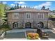 Exterior shot of clubhouse featuring stone accents, landscaped grounds and well kept parking lot at 1965 Carlotta Ct, Atlanta, GA 30345