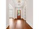 Hallway with hardwood floors and detailed trim leads to rooms with bright, natural light at 1965 Carlotta Ct, Atlanta, GA 30345