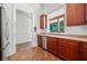 Practical kitchen layout with wood cabinetry, granite counters, and stainless steel appliances at 1965 Carlotta Ct, Atlanta, GA 30345