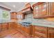 Well-appointed kitchen with custom cabinetry, granite countertops, and stainless steel range at 1965 Carlotta Ct, Atlanta, GA 30345