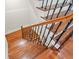 Beautiful staircase with hardwood treads, decorative iron railing, and a curved handrail at 1965 Carlotta Ct, Atlanta, GA 30345