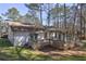 Charming backyard retreat with multiple decks, ideal for entertaining and enjoying the natural surroundings at 3085 Nappa Trl, Stone Mountain, GA 30087