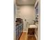 Cozy bar area with modern shelving, a sink, and an upholstered bar stool at 3085 Nappa Trl, Stone Mountain, GA 30087