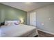 Cozy bedroom showcasing wood-look flooring and light-colored walls, creating a serene and inviting ambiance at 3085 Nappa Trl, Stone Mountain, GA 30087