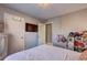 This bedroom features a TV mounted on the wall and a storage cabinet, providing both entertainment and functionality at 3085 Nappa Trl, Stone Mountain, GA 30087