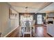 Bright dining room with a modern chandelier, a large table, and a scenic view at 3085 Nappa Trl, Stone Mountain, GA 30087