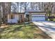 Charming single-story home featuring a stone facade, attached garage, and well-maintained front lawn at 3085 Nappa Trl, Stone Mountain, GA 30087