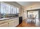 Open kitchen with a view to the dining room, featuring stainless steel appliances and granite countertops at 3085 Nappa Trl, Stone Mountain, GA 30087