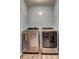 A modern laundry room is equipped with a stainless steel washer and dryer, providing convenience and efficiency at 3085 Nappa Trl, Stone Mountain, GA 30087