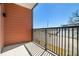 Private balcony with black metal railing and wood-look exterior walls at 525 Parkway Ne Dr # 314, Atlanta, GA 30354