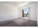 Sunlit bedroom with plush carpeting and sliding doors to a private balcony at 525 Parkway Ne Dr # 314, Atlanta, GA 30354