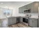 Well-lit kitchen with modern appliances and fixtures, complemented by hardwood flooring at 525 Parkway Ne Dr # 314, Atlanta, GA 30354