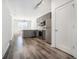 Open concept kitchen featuring gray cabinetry and stainless steel appliances adjacent to a living space at 525 Parkway Ne Dr # 314, Atlanta, GA 30354