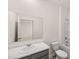 Well-lit bathroom features a large mirror and modern fixtures at 5436 Flat Rock Point Pt, Stonecrest, GA 30038