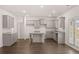 Bright kitchen showcasing grey cabinetry, granite countertops, and stainless steel sink at 5436 Flat Rock Point Pt, Stonecrest, GA 30038