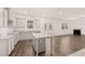 Modern kitchen with granite countertops, center island, and adjacent living area with fireplace at 5436 Flat Rock Point Pt, Stonecrest, GA 30038